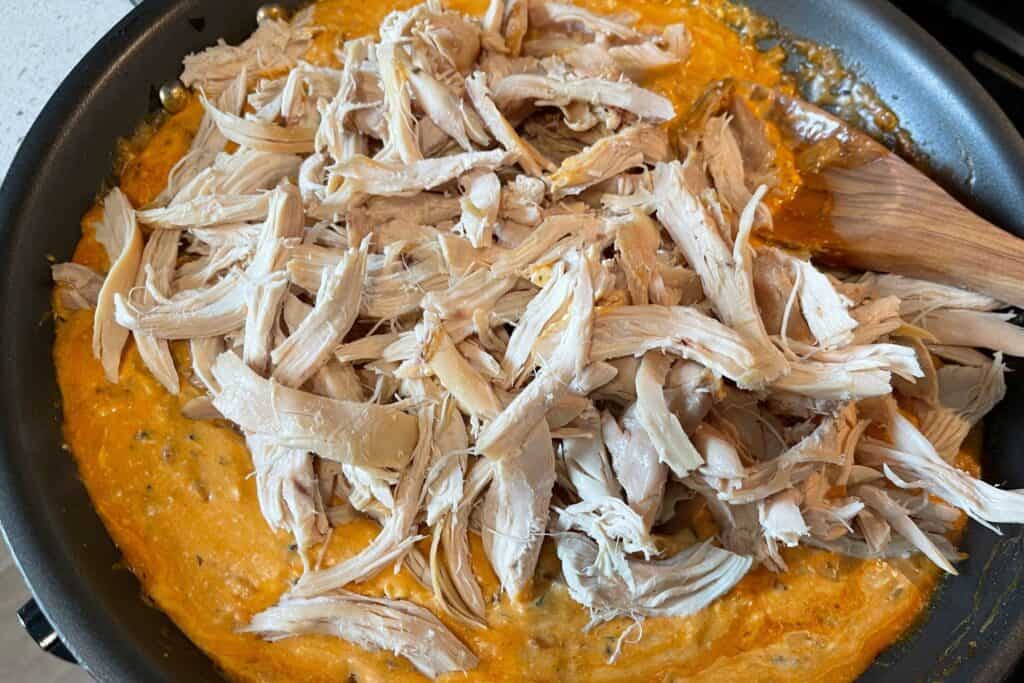 pulled rotisserie chicken added to the buffalo cream cheese sauce
