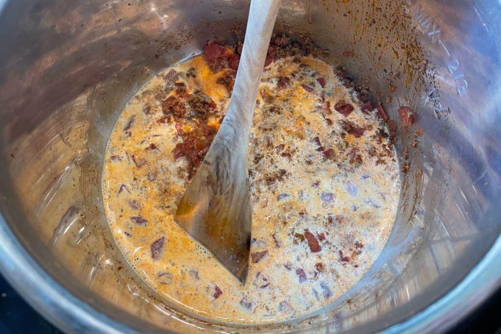evaporated milk added to the cooked chorizo and RO-TEL