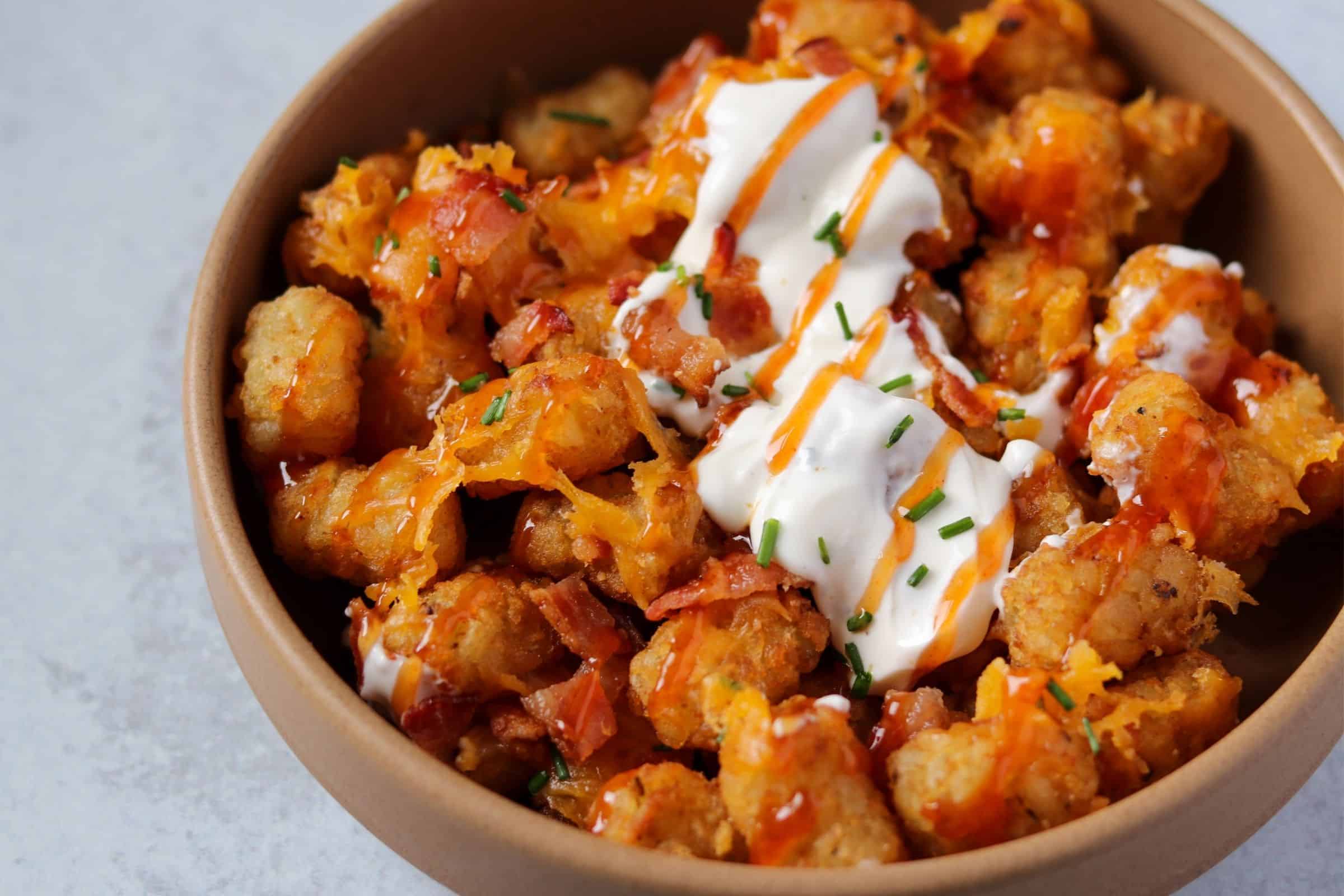 Loaded Air Fryer Frozen Tater Tots with Bacon, Cheddar, and Sour Cream