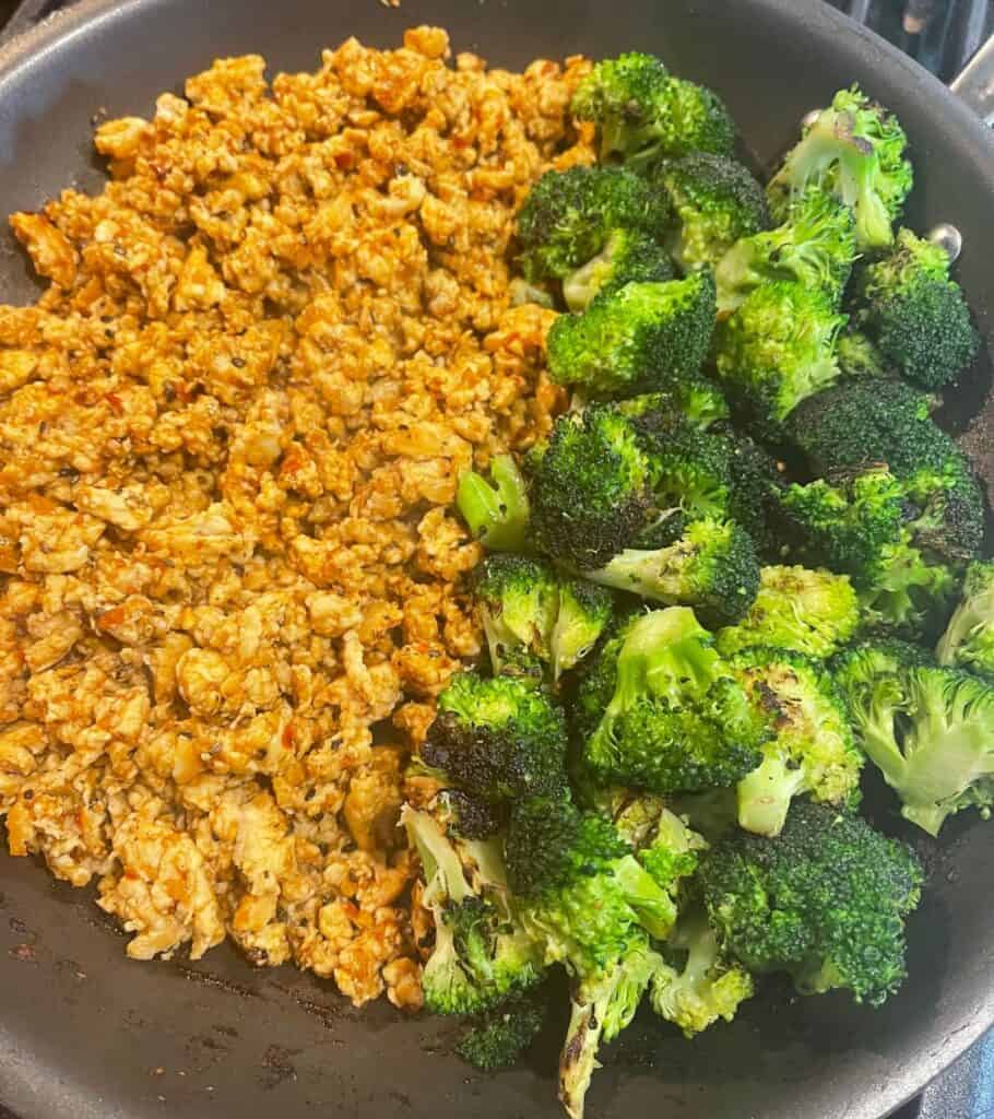 sauced ground chicken with broccoli in the pan together