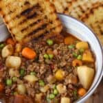 bowl of vegetable beef soup with grilled bread