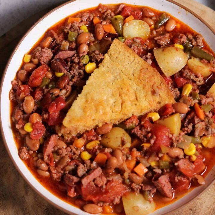 bowl of cowboy stew with brown butter smoked cornbread