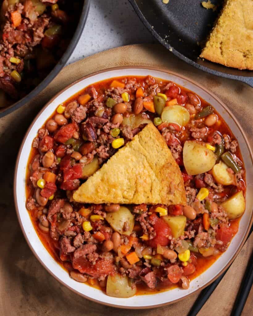 brown butter smoked cornbread in a bowl with cowboy stew