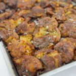 smashed potatoes on a sheet pan