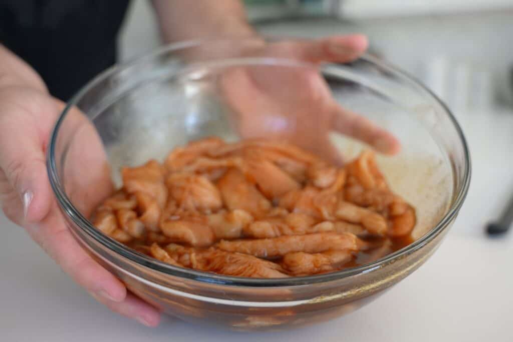 slices of chicken breast in a marinade