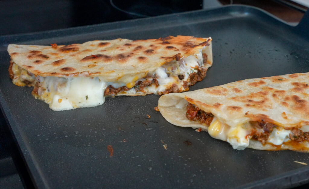 melted Oaxaca cheese in a ground beef quesadilla