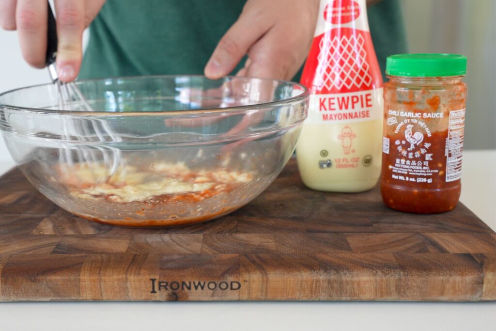 kewpie mayo and chili garlic sauce in a mixing bowl