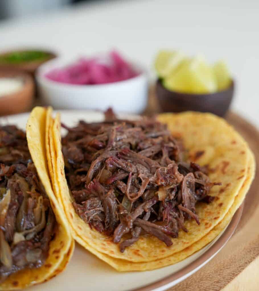 smoked pulled beef on a corn and flour tortilla