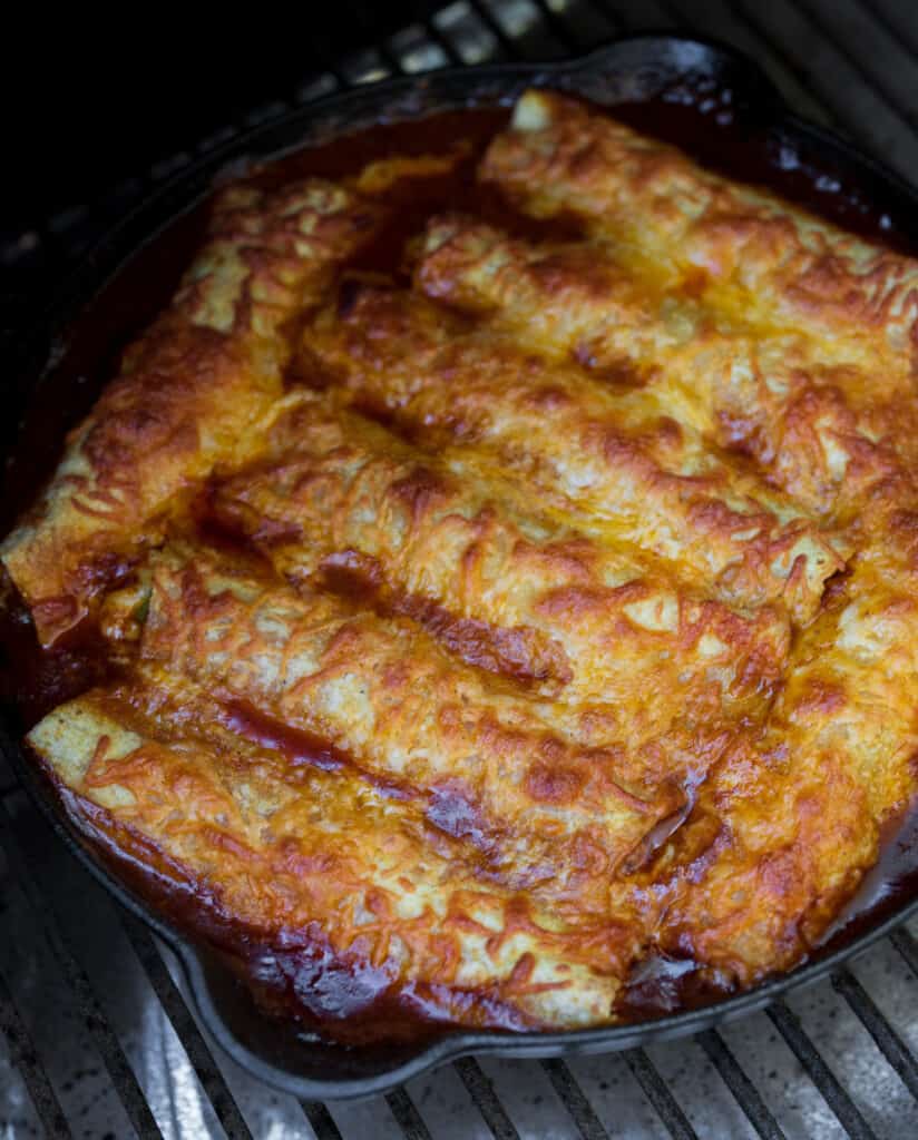 staub cast iron skillet with smoked chili con carne and cheese enchiladas