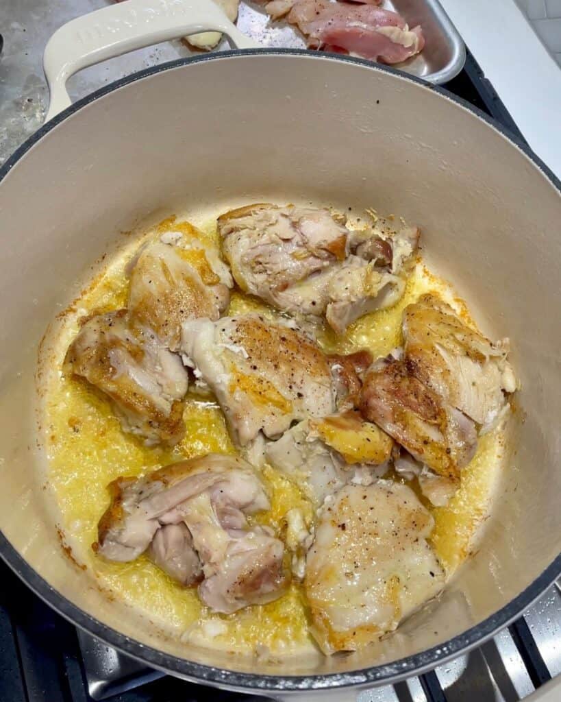 cooking boneless skinless chicken thighs in a Dutch oven with olive oil