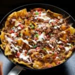 skillet of smoked nachos on a Traeger grill