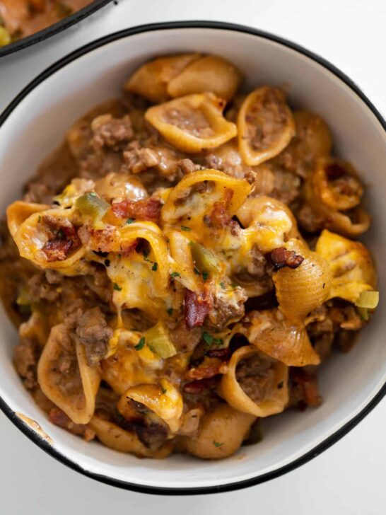 ground beef and bacon cheeseburger pasta in a white bowl