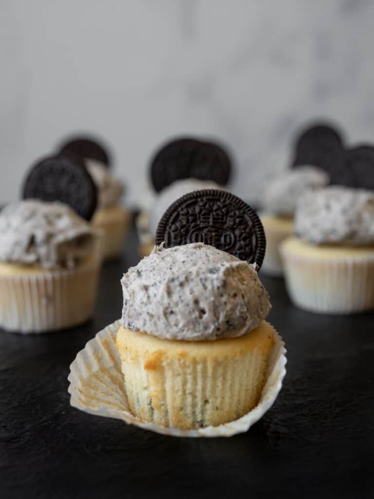 Cookies and cream cupcakes with Oreos on top.